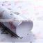 Ivory plastic gift wrapping paper roll