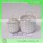 small round wicker storage basket with two ears