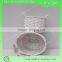 small round wicker storage basket with two ears