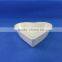 white ceramic heart shaped bowl