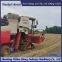 Modification of wheat harvester with triangular track wheels to prevent slipping on muddy ground