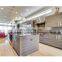 Pleasant cream color L shape kitchen cabinets price