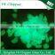 Blue green glowing glass chips for garden decoration