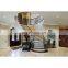 arc curved stairs with metal railing and thick wood stair tread