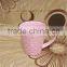 bright pink ceramic tea cup in embossed with dark gold rim