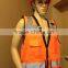 Orange high visibility safety vest with many pockets