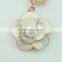 Megneic elegant woman pearl metal rhinestone keychain flower design plastic acrylic key ring for woman                        
                                                                                Supplier's Choice