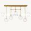 Postmodern Creative Light Luxury Brass Blown Glass Globe Mobile Linear Chandelier Hotel Bedroom Restaurant Ceiling Lighting