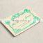  credible supplier manufacture leather label with white background and green letters for girls pajama coat