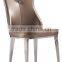 Concaved headrest dinning chair with white glossy PU covering and iron legs