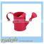 colorful small metal watering can