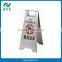 foldable caution wet floor stand in school dining room