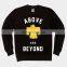 black crewneck sweatshirt with yellow felt embroidered eagle patch