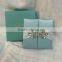 2016 hot sale high-auality elegant blue silk box wedding invitations with white ribbons and rhinestone brooches                        
                                                Quality Choice