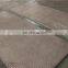 Bi-metal wear resistant plates for vibrating pans
