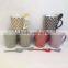 China supplier ceramic mug and best home glazed porcelain travel V-Shape Mug ,with spoon