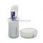white toothpaste and toothbrush holder
