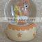 Hot sale eco-friendly warm color baby series snow globes wholesale