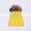 Bright yellow knitting beanie hats with big fur pompoms for winter warm KZ160075