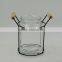 Clear Glass Vase In Black Iron Basket With Wood Handle