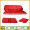 Red polar fleece blanket for airline travel in a zipper bag easy for carry