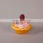 Decorative fake cup cake with fruits for holiday and wedding decor