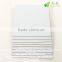 Uncoated white/pink laminated grey board