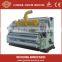 corrugated carboard production line including single facer mill roll stand and slitting cutting machine