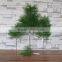Plastic green cypress branch