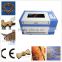 2015 hot selling wood arcylic leather portable 50w co2 laser engraving and cutting machine 6040