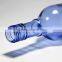 Blue clear glass wine bottle witn long neck beer bottle