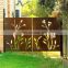 Laser cut corten steel garden gates with black powder coated posts
