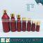 Red colored european glass essential oil bottle with gold cap