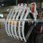 Forklift Attachment With Hinged Broke Handler and Material Handling Clamp