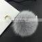 Handmade fox fur ball keychain with leather strap