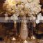 White Wedding Orchids Centerpiece in a silver lined vase for the other half of the centerpieces at the reception