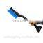 Heated and plastic snow shovel with brush