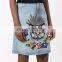Light indigo cotton embroidered denim skirt from W.W.S. featuring a five pocket design