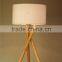 wholesale modern style wood tripod table lamp with barrel fabric lamp shade for hotel guest room decor