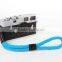 Cotton various color camera strap with leather hand strap.