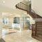 arc curved stairs with metal railing and thick wood stair tread