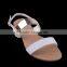 Party wear fancy stylish flat buckled up sandals for girls with shiny upper material