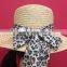 woven straw hat with camouflage band