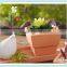 square terracotta flower pot with square design for plants