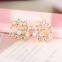 New Brand Design Hollow Out Flower Bow Stud Earrings With Shiny Crystal Simple Metal Ear for Women Earrings Jewelry