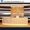 White lighted high glossy elegant beauty salon hotel reception counter