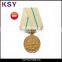 Nickle free metal medal with brass plating