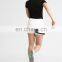 Hot sale college tennis match wear fashion design ,custom white color tennis sports skirts women wear