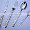 silver and gold cutlery set