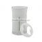 white toothpaste and toothbrush holder